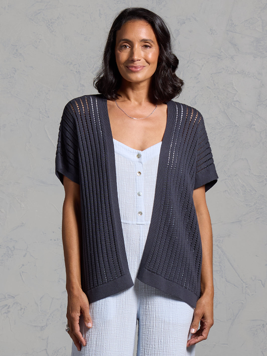 A woman wearing a charcoal cotton kimono from Nomad the Label