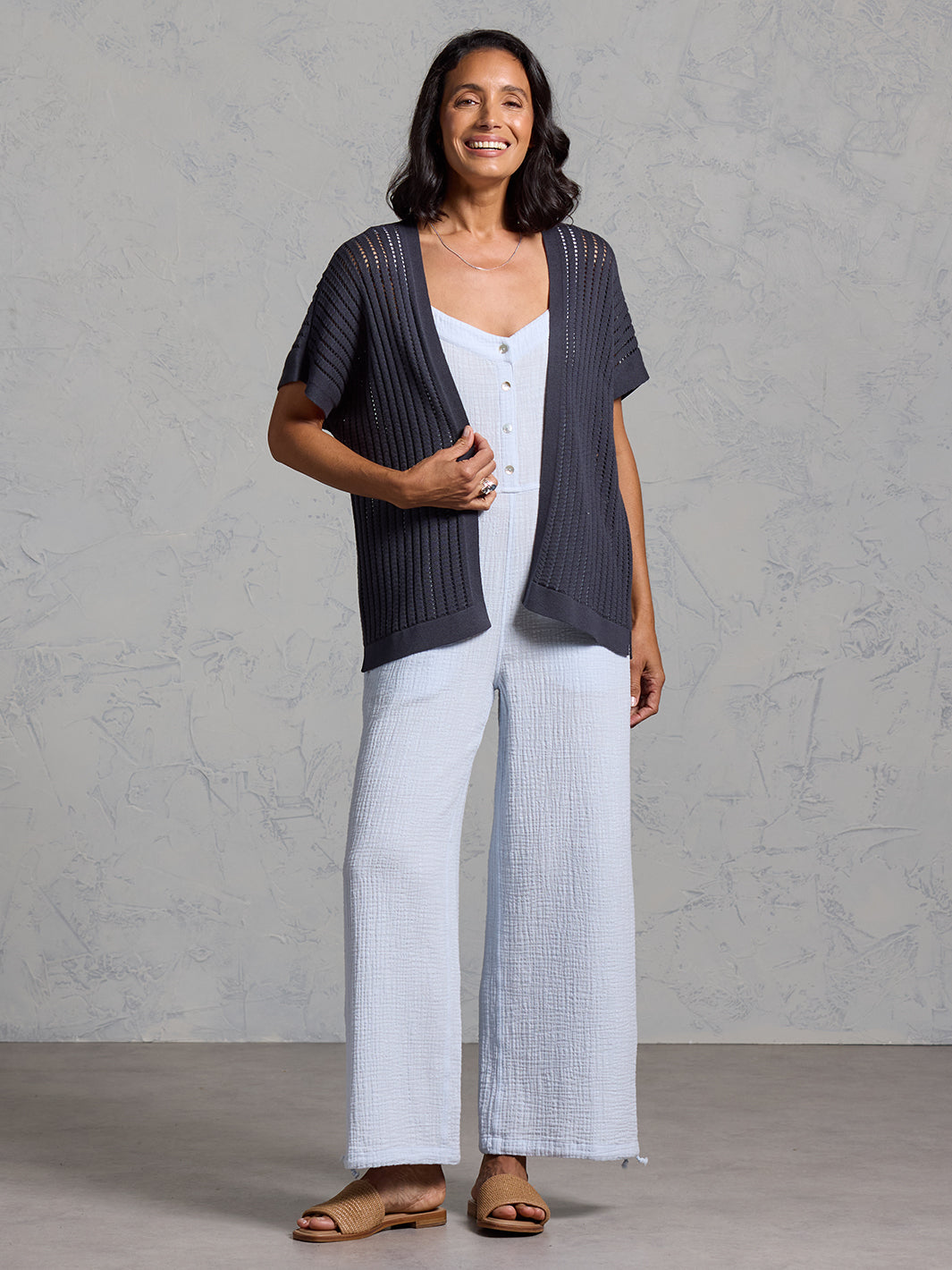 A woman wearing a charcoal cotton kimono from Nomad the Label