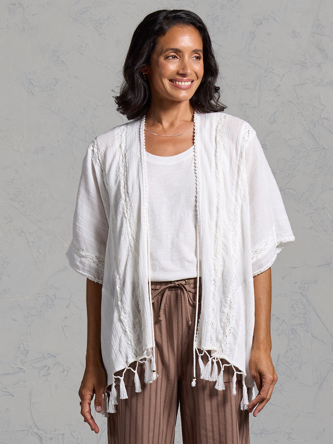 Woman wearing the Solaris Cotton Kimono Coconut from Nomad the Label