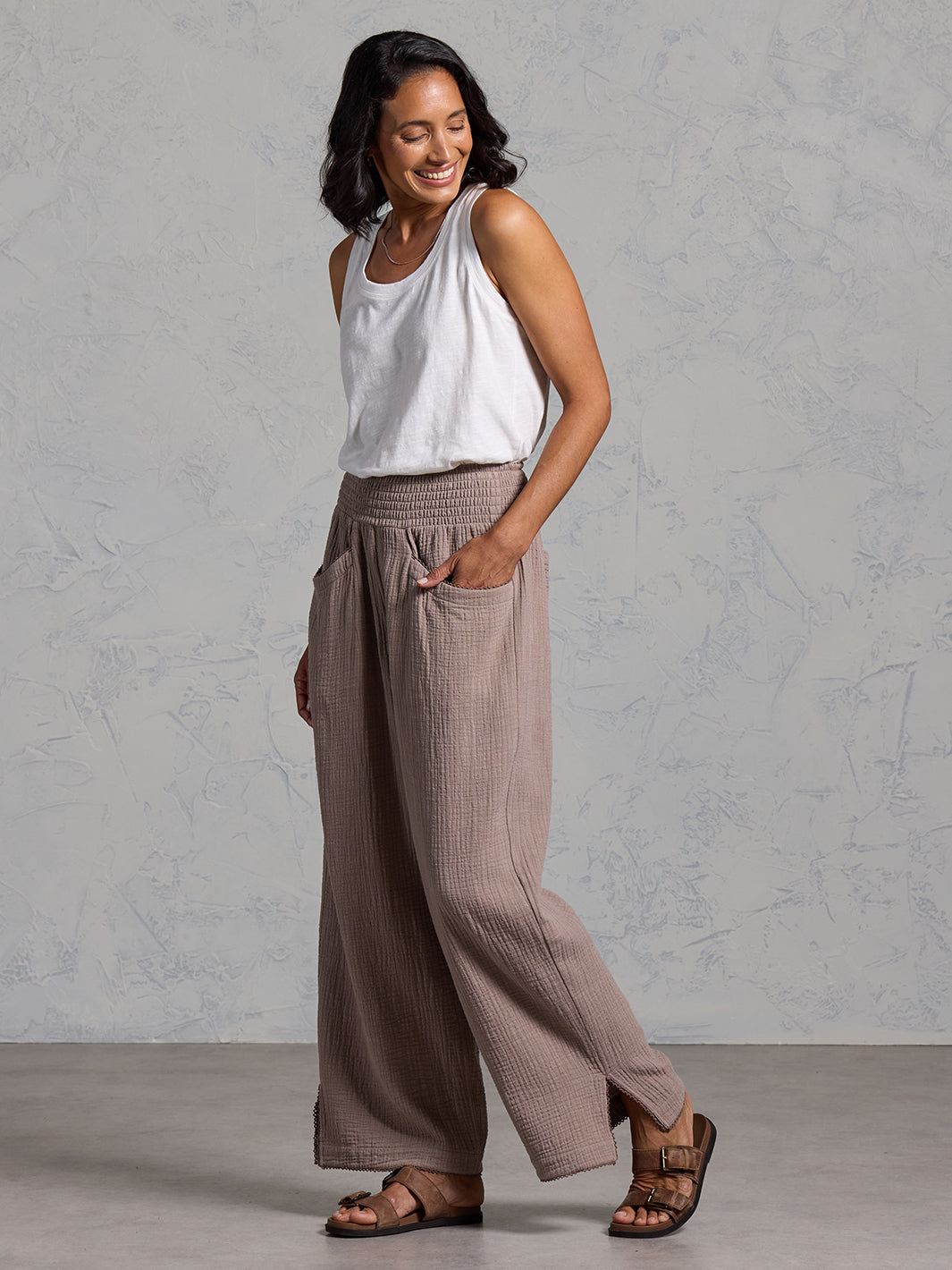 A woman wearing Sur Mer Organic Cotton Trousers Elm and Yarra Cotton Top Coconut from Nomad the Label