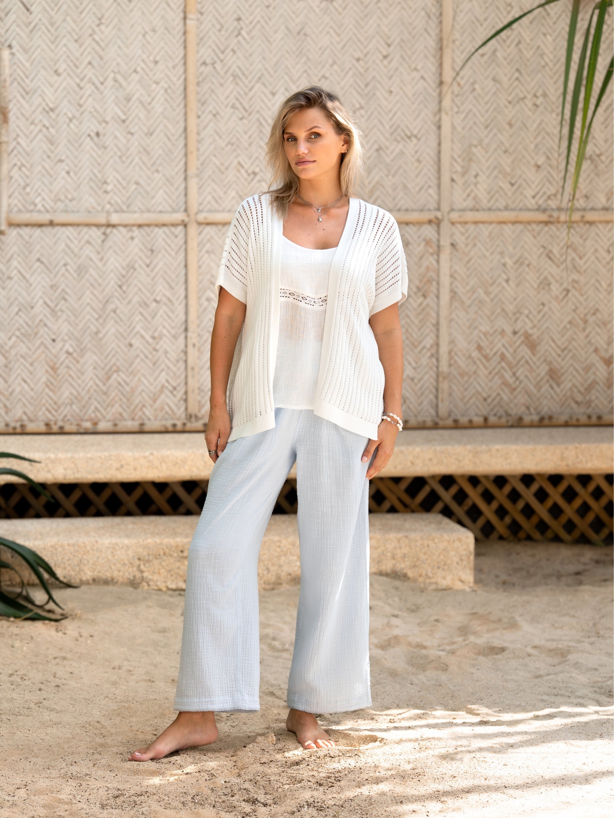 A woman wearing a coconut cotton kimono from Nomad the Label