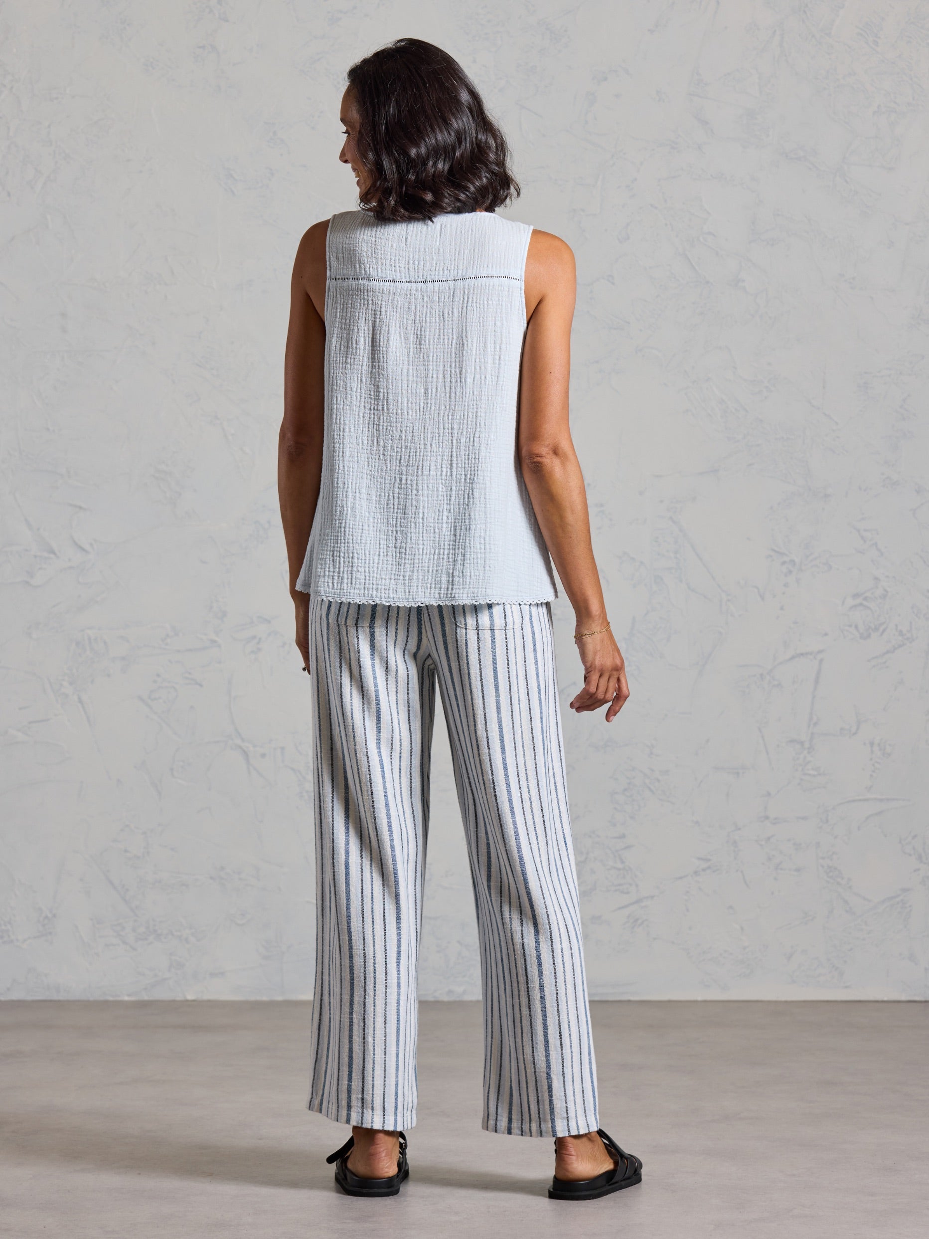 Back view of the Ceres Organic Cotton Top in serene blue showing the textured cotton and yoke seam detail.