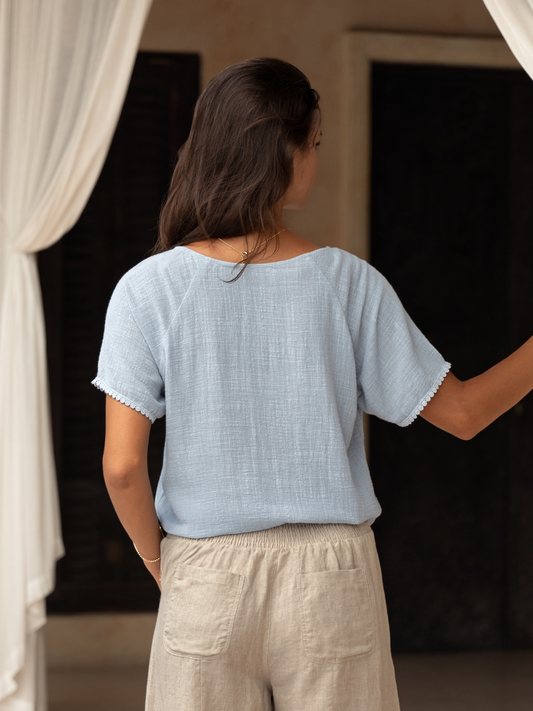 Model wears Daisy Organic Cotton Blouse Slate Blue