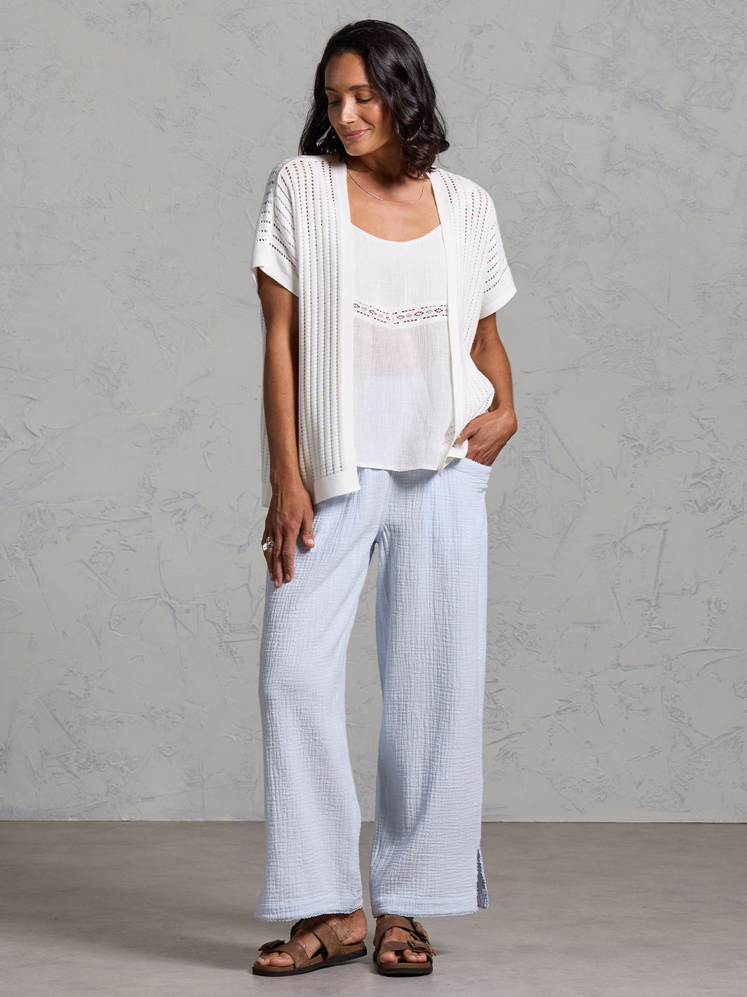 A woman wearing a coconut cotton kimono from Nomad the Label