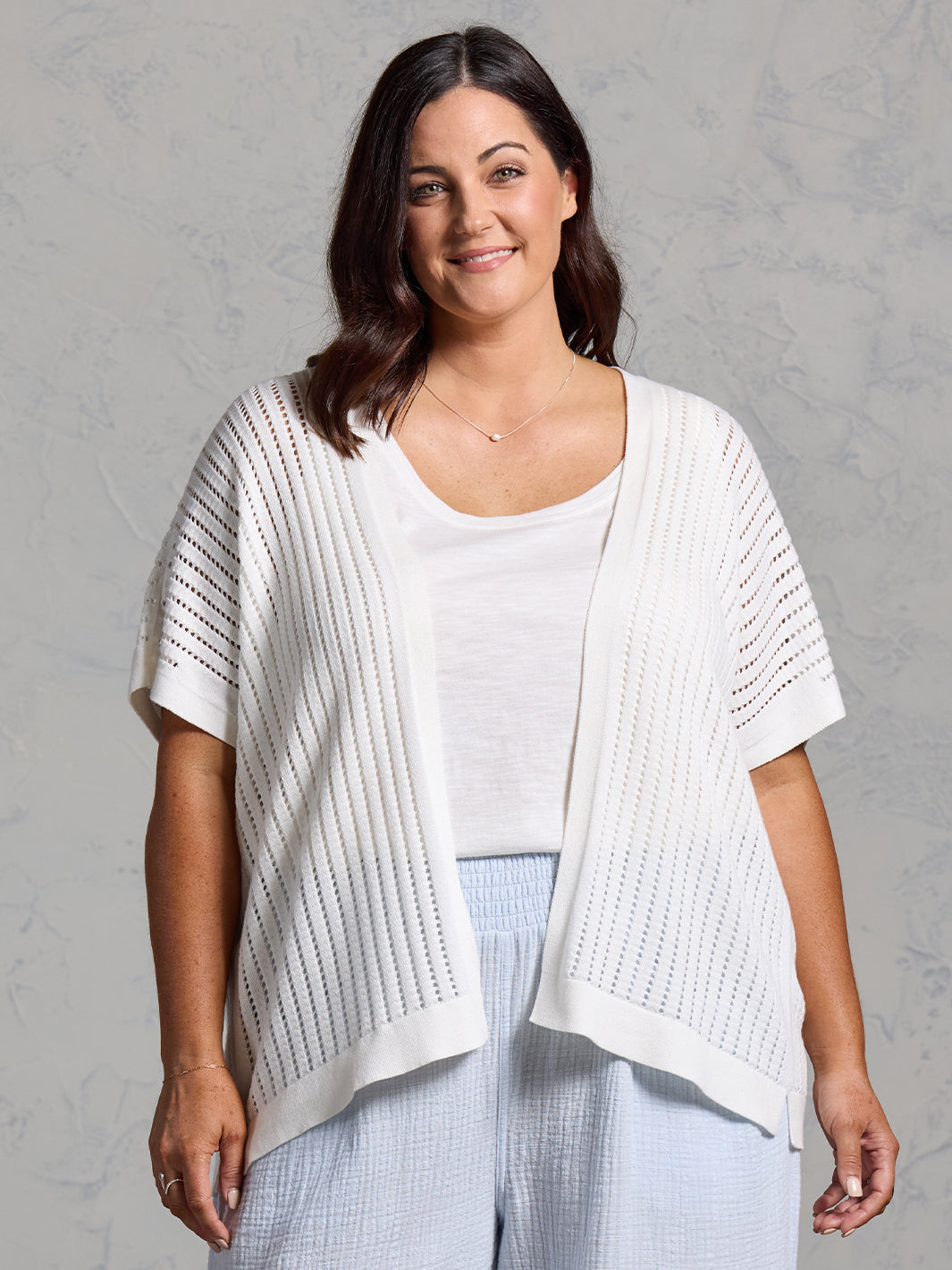 A woman wearing a coconut cotton kimono from Nomad the Label