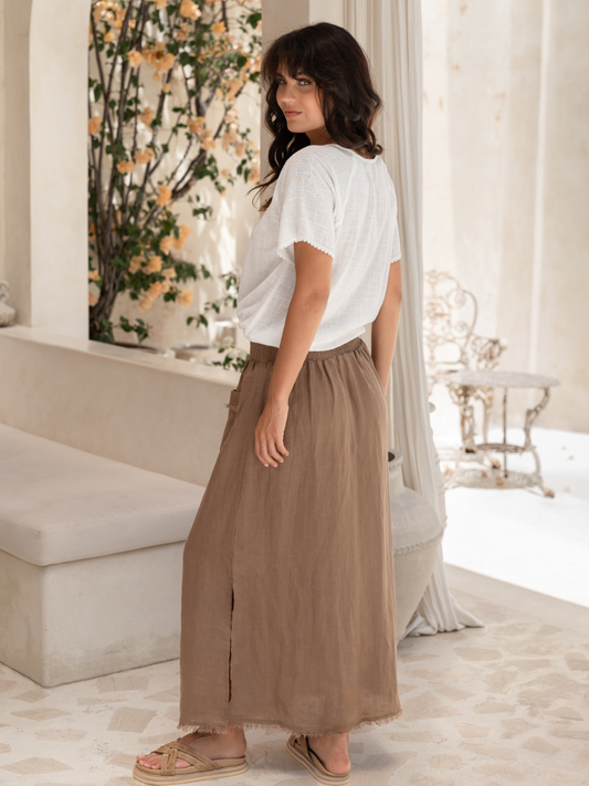 Model is wearing Aurora French Linen Skirt in Cinnamon