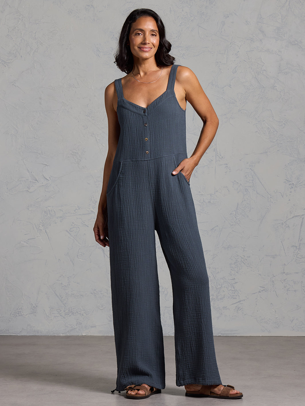 A woman wearing a charcoal cotton jumpsuit