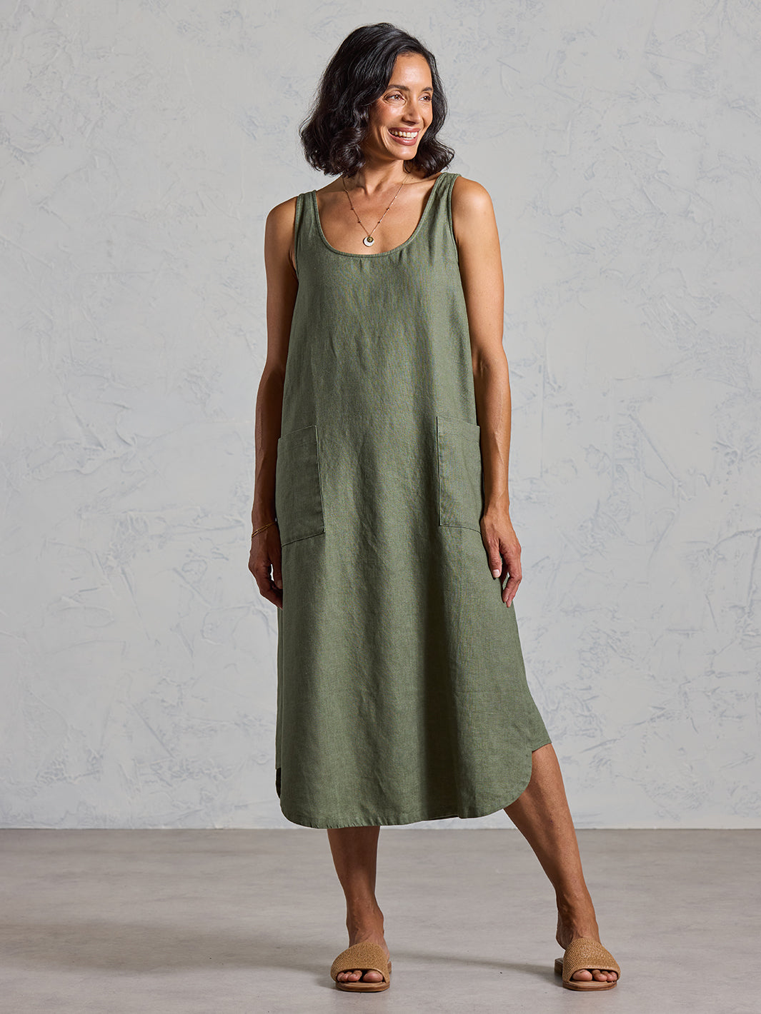 Model wearing Laurel French Linen Dress in Olive colour