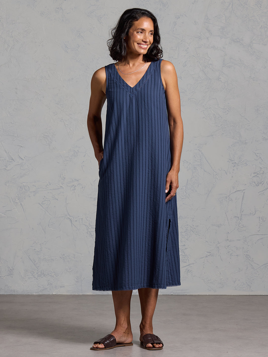 Woman wearing the Mimosa Organic Cotton Dress Navy from Nomad the Label