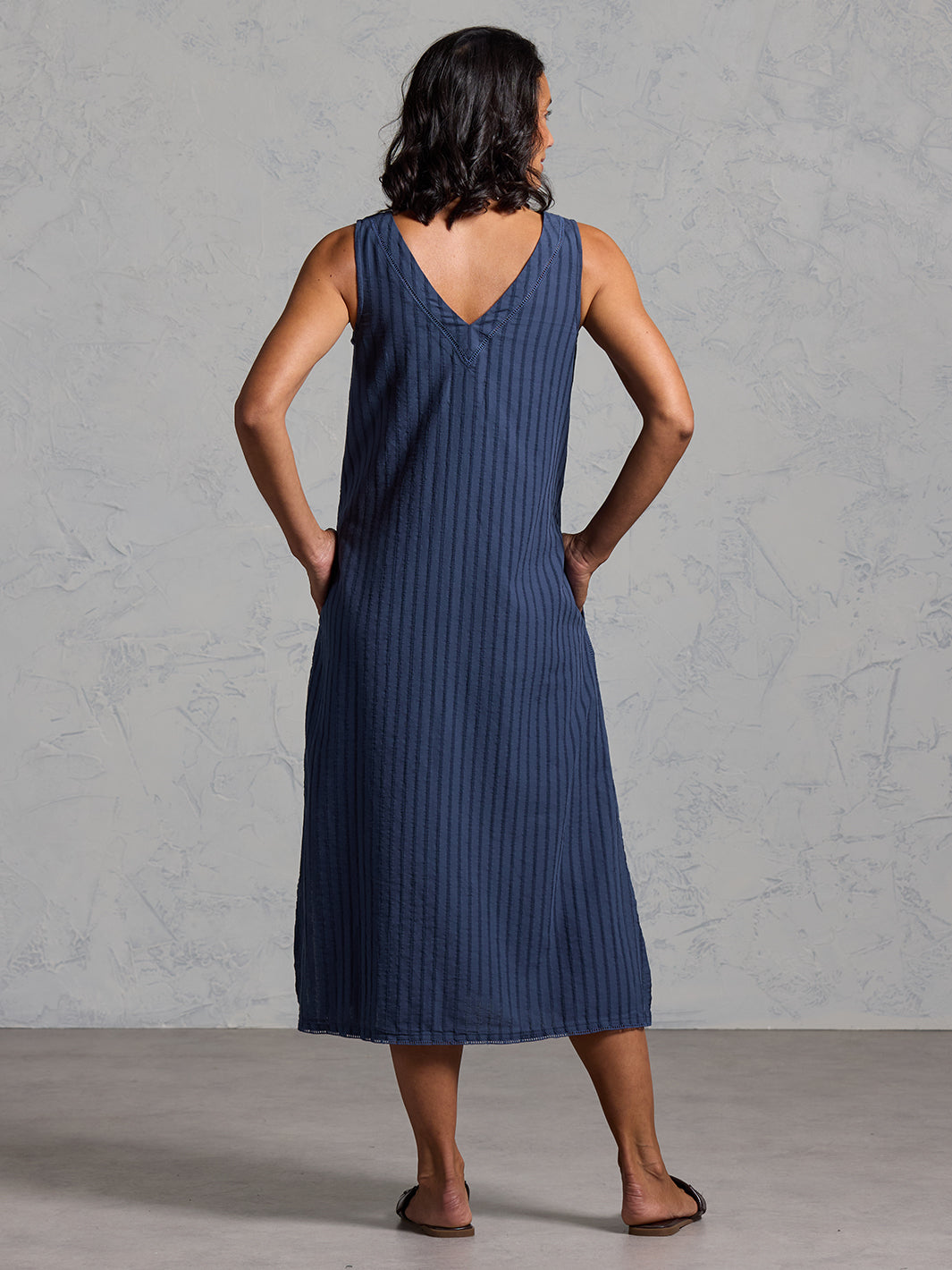 Woman wearing the Mimosa Organic Cotton Dress Navy from Nomad the Label