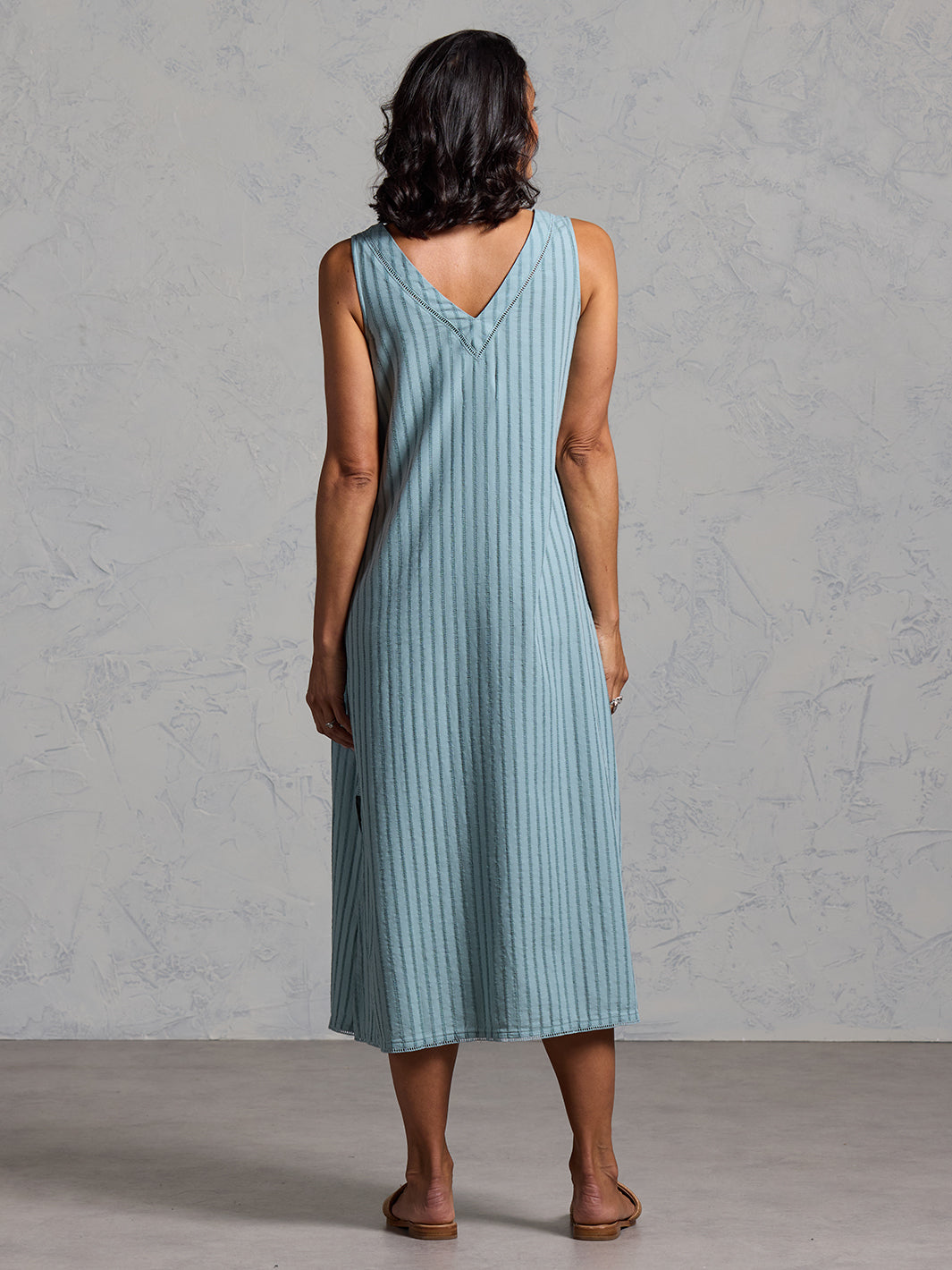 Woman wearing the Mimosa Organic Cotton Dress Marine Green from Nomad the Label