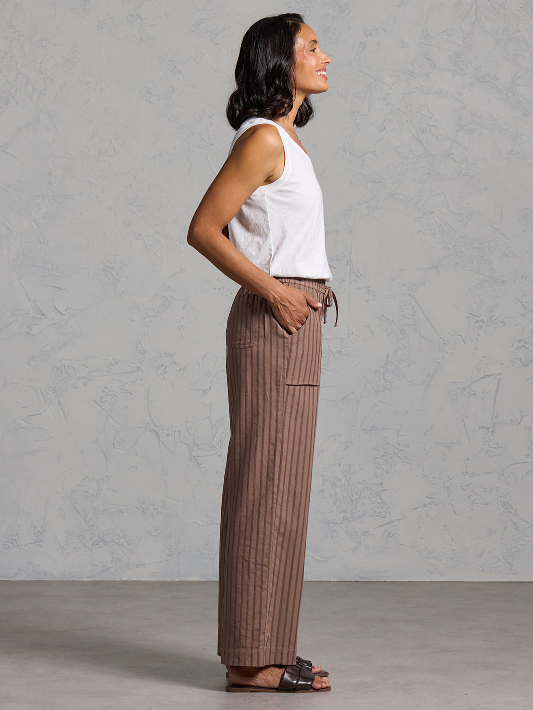 Woman wearing Sidari Organic Cotton Trousers Cinnamon from Nomad the Label