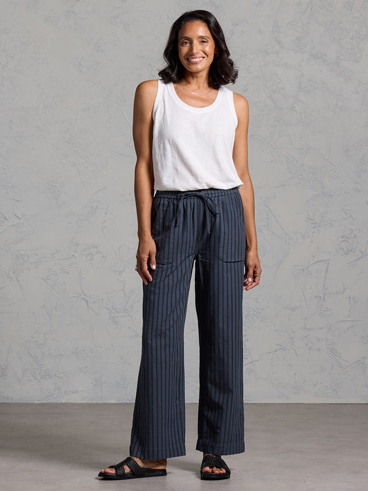 Woman wearing Sidari Organic Cotton Trousers Charcoal from Nomad the Label