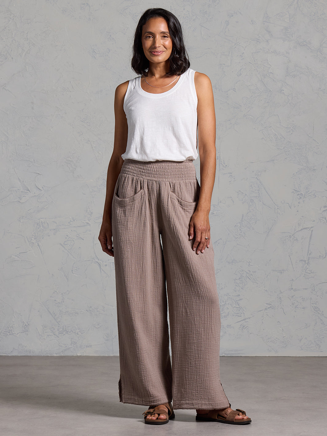 A woman wearing Sur Mer Organic Cotton Trousers Elm and Yarra Cotton Top Coconut from Nomad the Label
