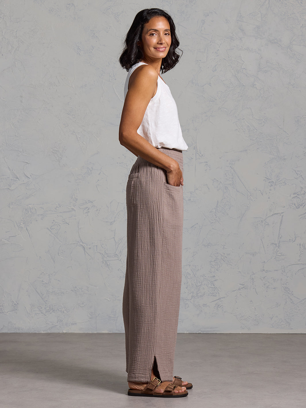A woman wearing Sur Mer Organic Cotton Trousers Elm and Yarra Cotton Top Coconut from Nomad the Label