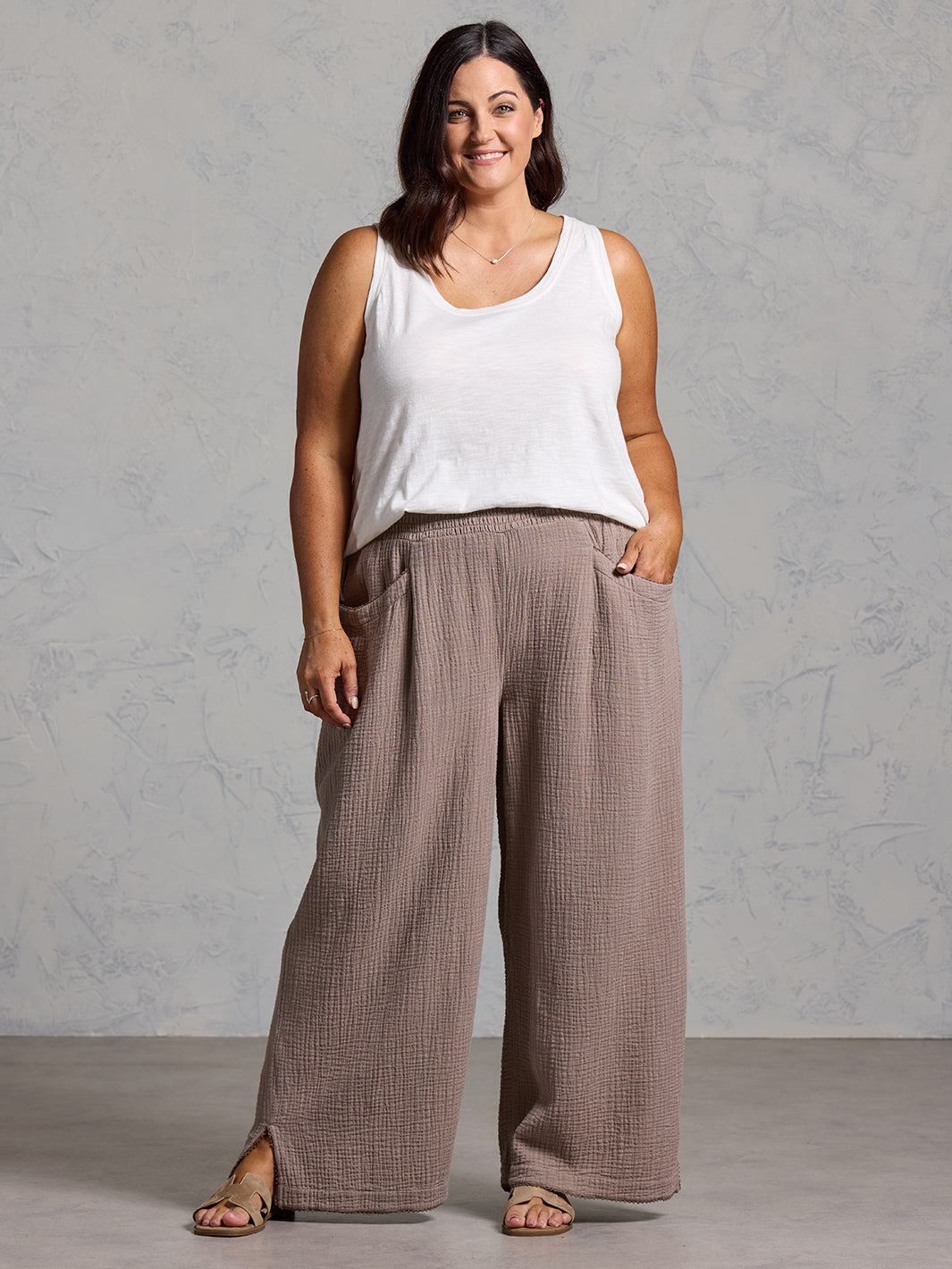 A woman wearing Sur Mer Organic Cotton Trousers Elm and Yarra Cotton Top Coconut from Nomad the Label
