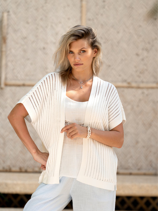 A woman wearing a coconut cotton kimono from Nomad the Label