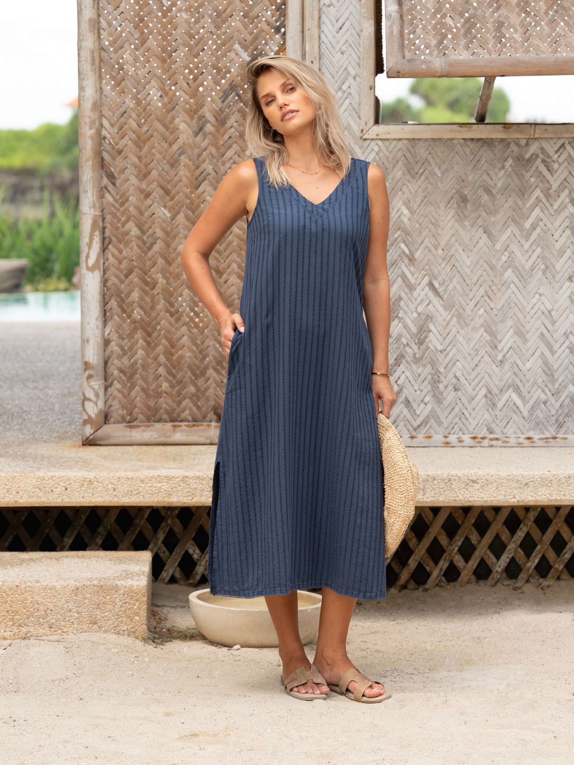 Woman wearing the Mimosa Organic Cotton Dress Navy from Nomad the Label