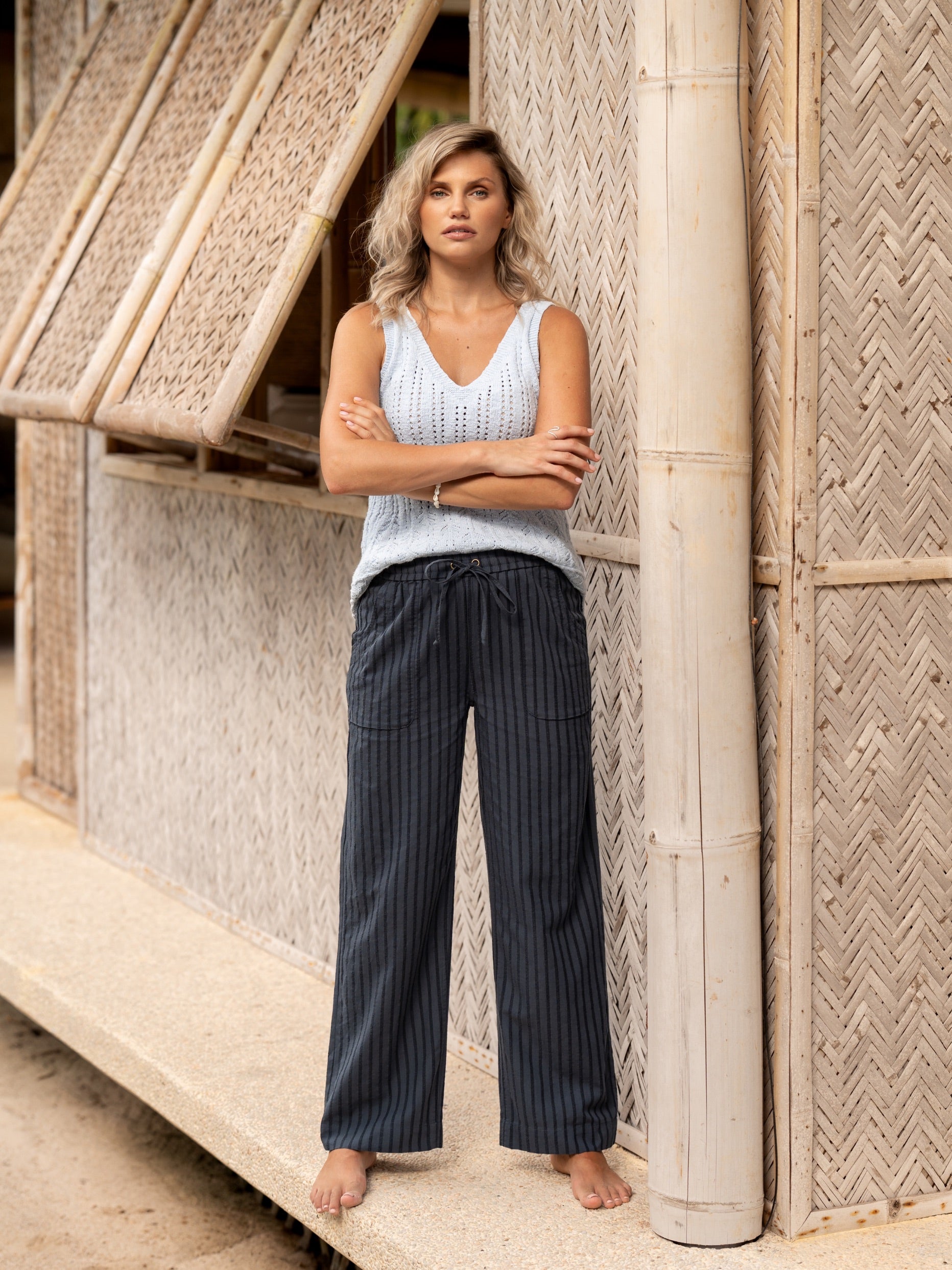 Woman wearing Sidari Organic Cotton Trousers Charcoal from Nomad the Label